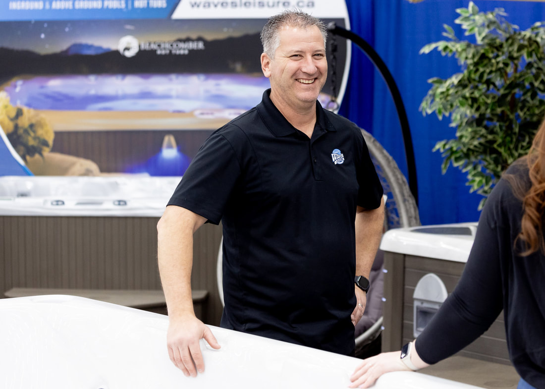 Owner of Waves Leisure, Trent Gray, working at Brandon Home & Leisure Show.